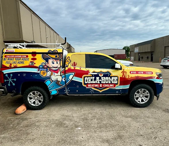Okla-Home branded service truck with mascot graphics ready for HVAC service call